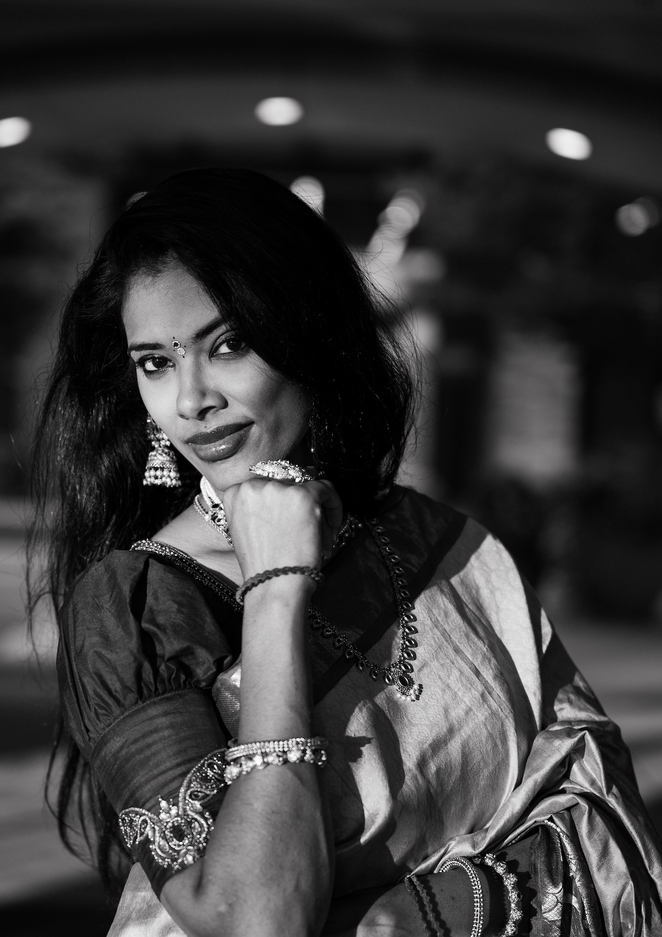 Black-and-white editorial portrait in a silver saree at night — Northern Virginia portrait photographer