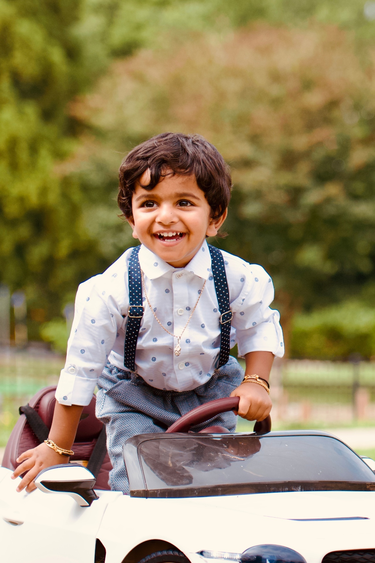 Child in a toy car