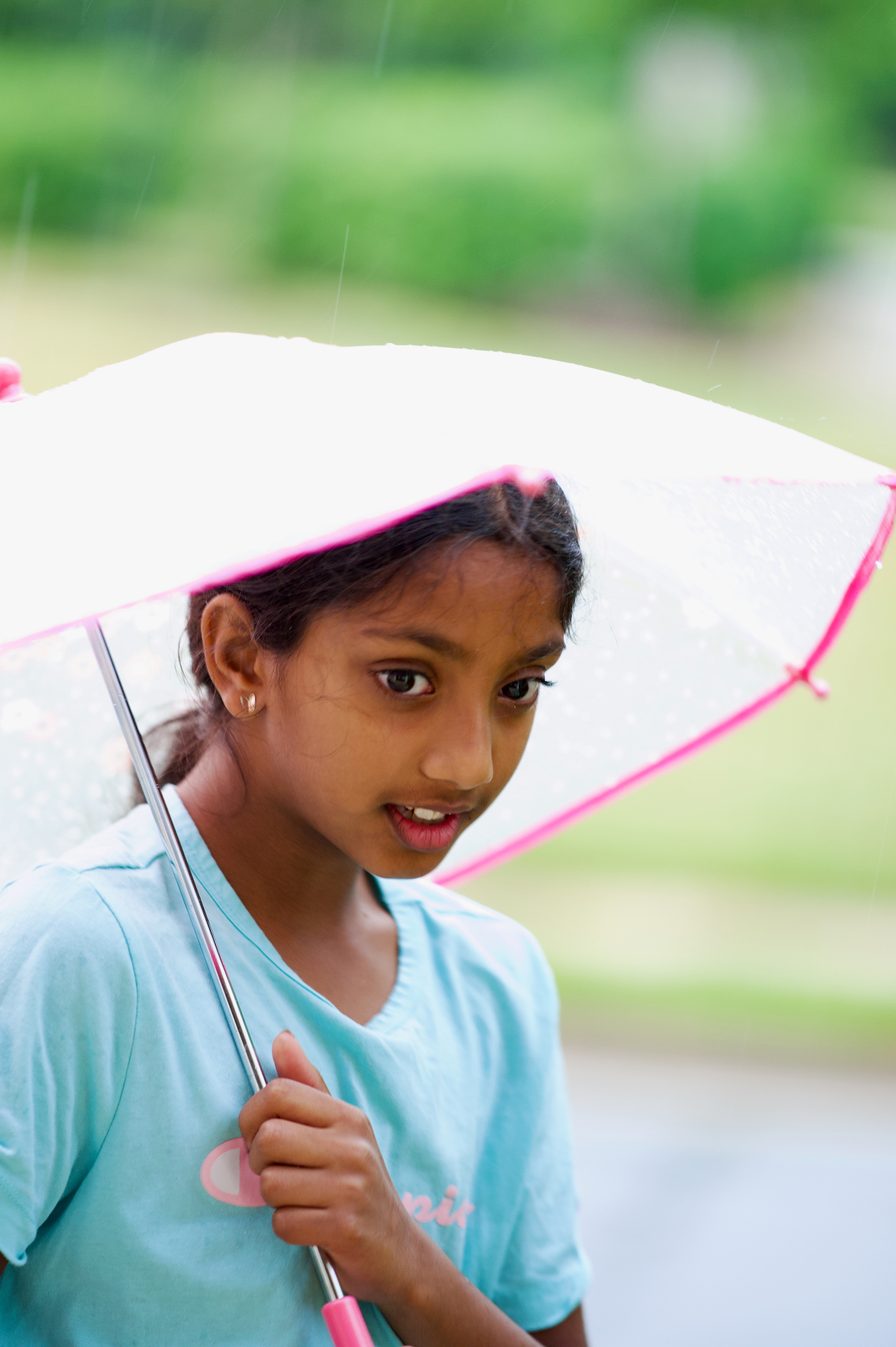 Nila with umbrella in rain