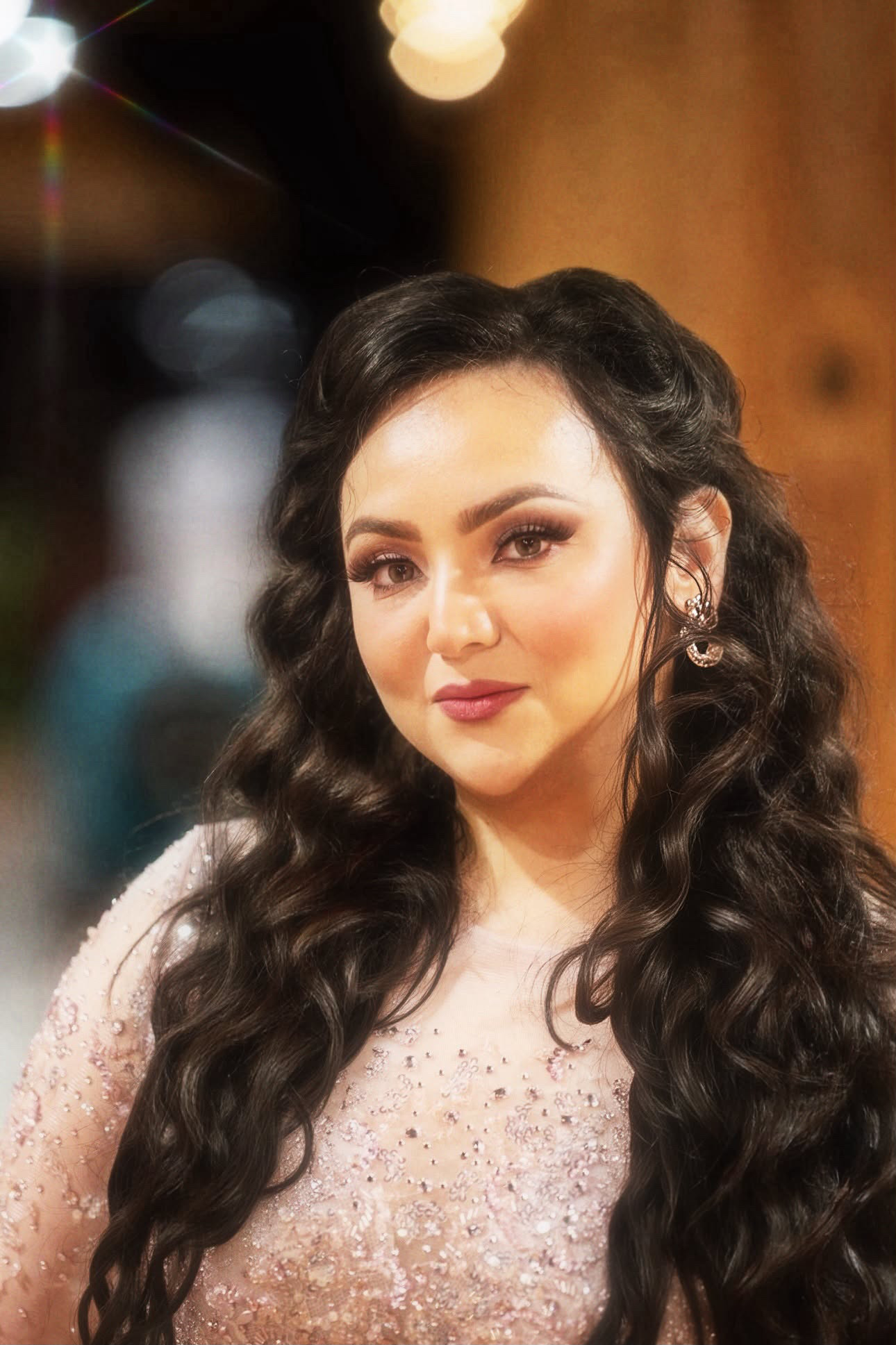 Blush beaded gown under warm bokeh lights — indoor fashion portrait by Vetri Frames, the DMV