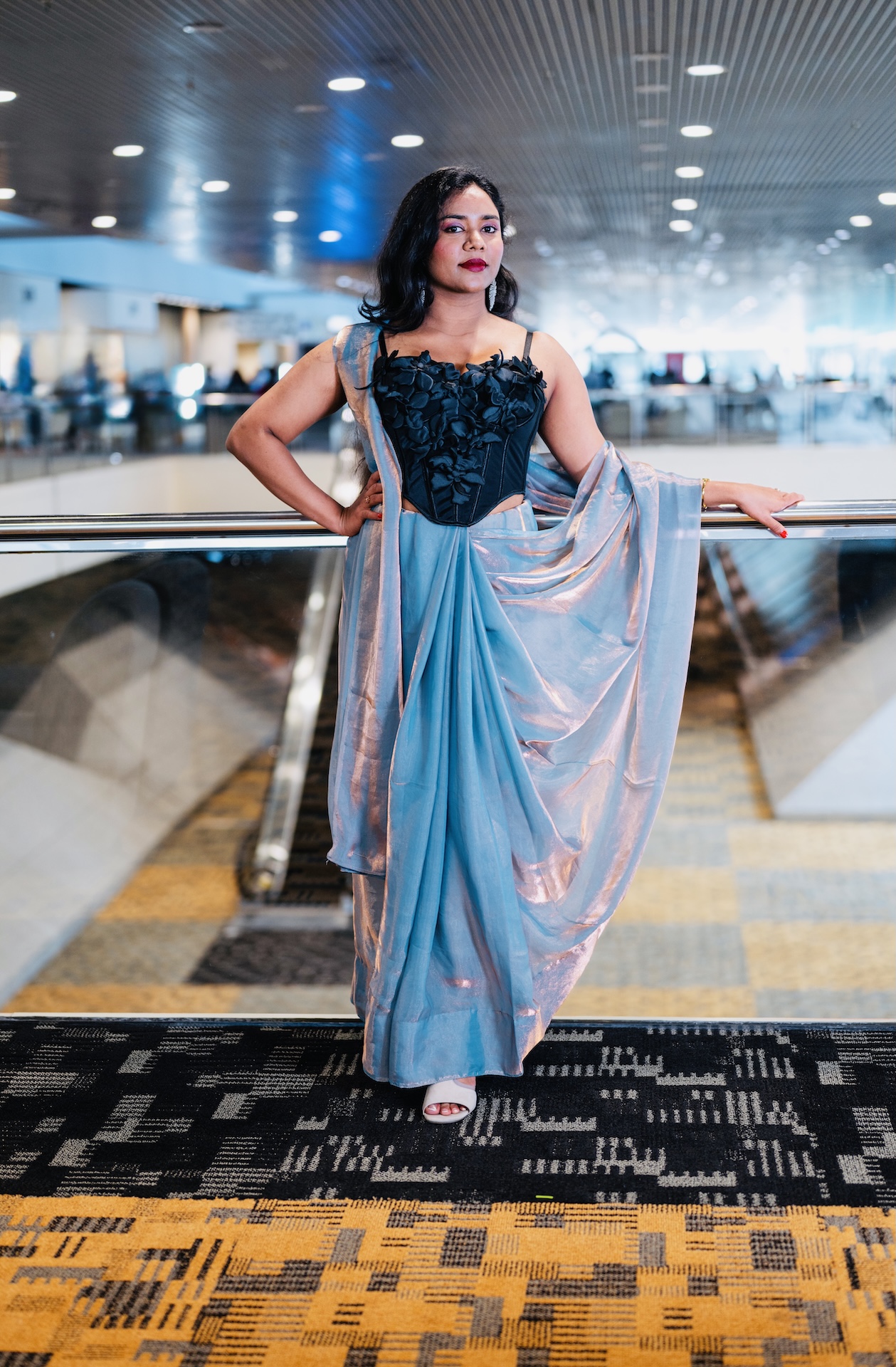 Metallic blue draped saree with a floral corset on a skywalk — Vetri Frames, Northern Virginia